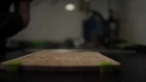 Close-Up of Hands Slicing Fresh Salmon Fillet on a Dark Background Stock-Footage 303908065