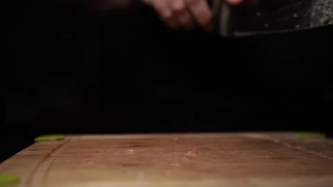 Close-Up of Hands Slicing Fresh Salmon Fillet on a Dark Background 스톡 동영상 303914085