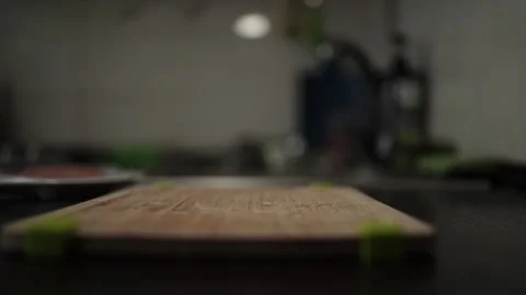 Close-Up of Hands Slicing Fresh Salmon Fillet on a Dark Background 스톡 동영상 303921674