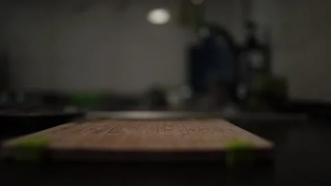 Close-Up of Hands Slicing Fresh Salmon Fillet on a Dark Background Stock Footage 303921765