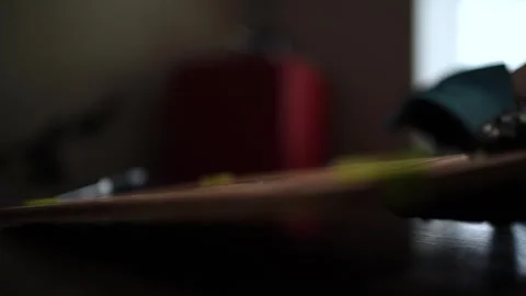 Close-Up of Hands Slicing Fresh Salmon Fillet on a Dark Background Видео 303925430