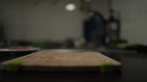 Close-Up of Hands Slicing Fresh Salmon Fillet on a Dark Background Vidéo 303926341