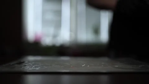 Close-Up of Hands Slicing Fresh Salmon Fillet on a Dark Background Video stock 303926461