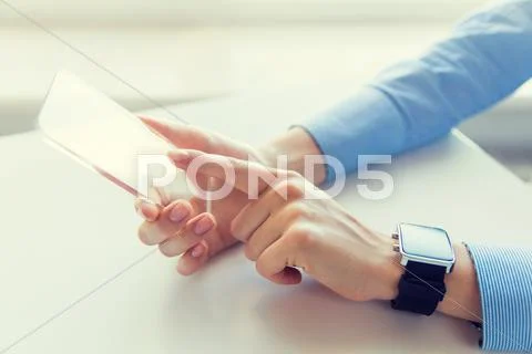 Close up of hands with smart phone and watch Stock Photos