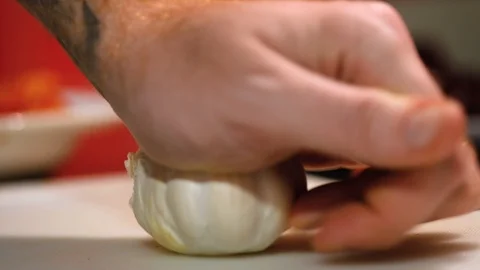 Close-up of hands smashing garlic Stock Footage 102472689
