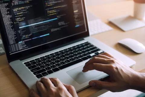 Close up hands of the software developers are sitting serious work analyzin.. 库存照片