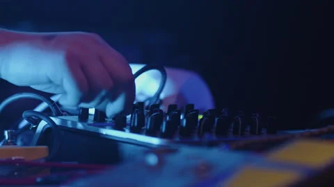 Close-up of the hands of a sound engineer adjusting the settings of a controller Vídeos de archivo 281109225