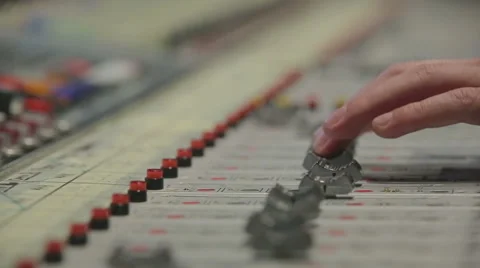 Close-up hands of sound engineer work with faders on mixer Stock Footage