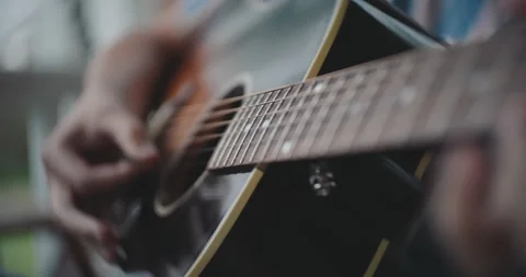 Close up of hands strumming and playing the acoustic guitar Stock Footage 306200646