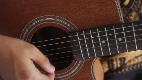 Close up of hands strumming and playing the acoustic guitar Stock Footage 322633190