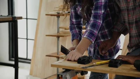 Close up hands student practicing woodworking from elderly carpenter Stock Footage 159664629