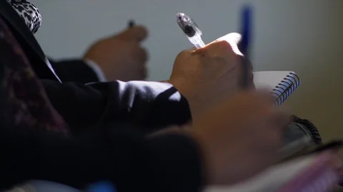 Close up hands, students taking notes in class. Stock Footage 90398899
