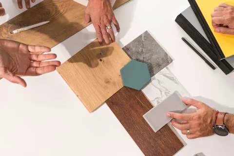 Close up of hands on the table during an office presentation with three young Stock Photos