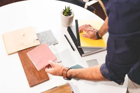 Close up of hands on the table during an office presentation with three young Stock Photos