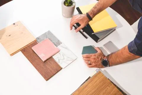 Close up of hands on the table during an office presentation with three young Stock Photos