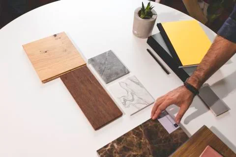 Close up of hands on the table during an office presentation with three young Stock Photos