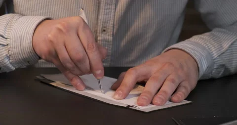 Close-up Hands. Tailor Master Carefully Cuts off Excess Skin on Patterns Stock Footage 133007262