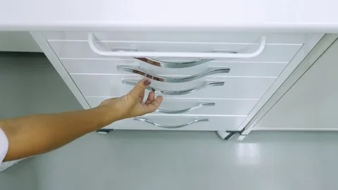 Close-up of hands taking and putting on surgical gloves from the box Video stock 81454739