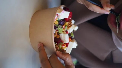 Close up hands taking delicious organic salad in a recycled container with .. Stock Footage 331719500