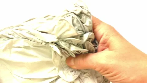 Close-up of hands taking gloves out of packaging. A woman takes out new medical Stock Footage 263765617