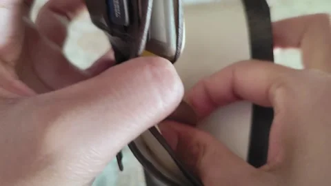 Close Up of Hands Taking Indian Ten Rupee Coins from Wallet Stock Footage 325303026