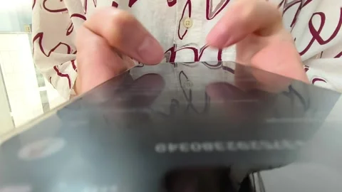 Close up hands tap on a smartphone screen. Fingers move across the glass wh.. Stock Footage 336963595
