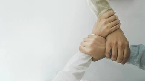 Close up hands Teamwork group of multi racial people meeting join hands. Stock Photos