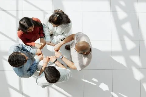 Close up hands Teamwork group of multi racial people meeting join hands. Stock Photos
