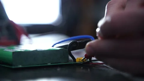 Close up of hands testing electrical currents. This is an engineer Stock Footage 169081767