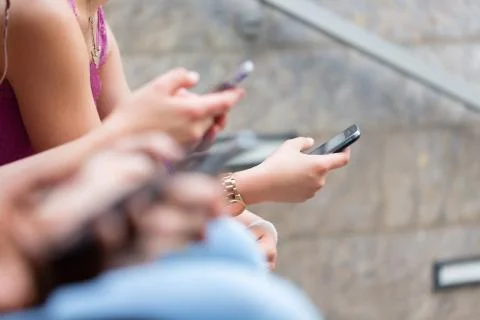 Close-up of hands texting on smartphone Stock Photos