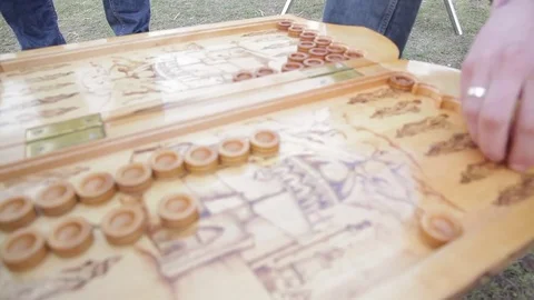 Close-up. hands throw the dice. play backgammon. in the open air Video stock 72189396