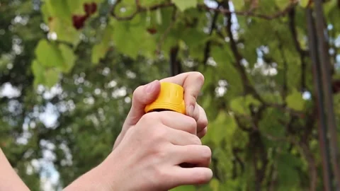 Close-up of hands tightening yellow plastic connector (quick release) Видео 344879115
