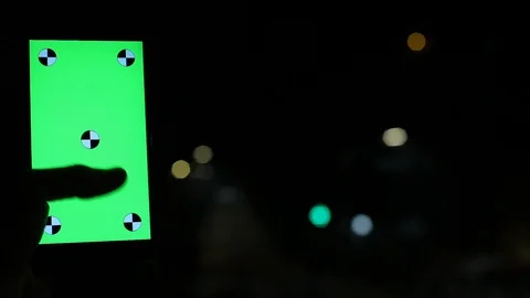 Close-Up Of Hands Touch Smartphone Green Screen In The City at Night Video stock 127863761