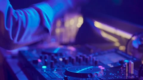 Close up hands touching buttons sliders, playing electronic music on mixing deck Stock Footage 166885932