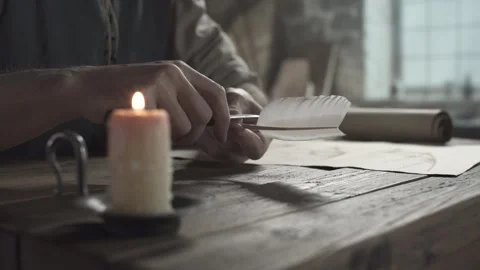 Close up of hands trimming a quill pen barb with a small penknife Vídeo Stock 340080014