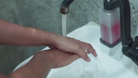 Close up of hands turning on faucet and washing Video stock 345202803