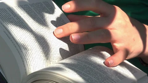 Close up on hands turning pages Stock Footage 41421078