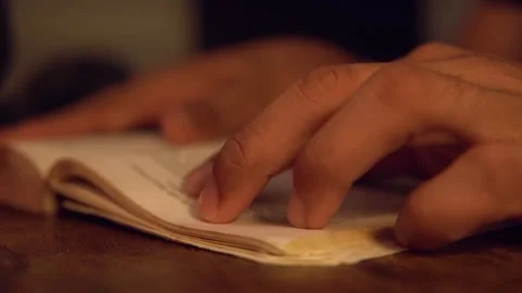 Close up of hands turning pages of old book Video stock 320967515