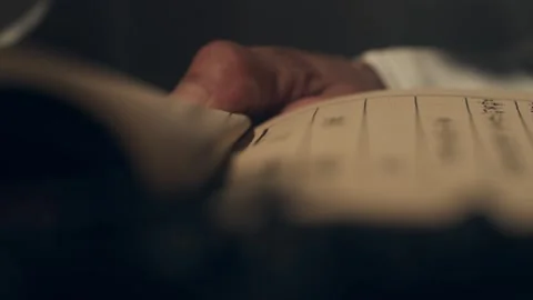 Close-up of Hands Turning Pages of Old Document Vidéo 334646675