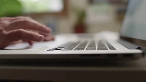 Close up of hands typing and using the trackpad on a laptop Video stock 134267860