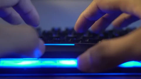 Close up of hands typing on backlit computer keyboard Stock Footage 320968391