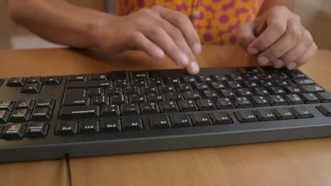Close-up of hands typing on a black computer keyboard with Cyrillic letters Video stock 316118629