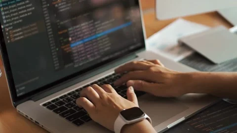 Close up of hands typing code on a laptop keyboard technology, Programmer woman Video stock 334585830