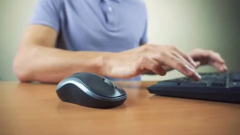 Close up of hands typing on computer keyboard and mouse Video stock 83509918