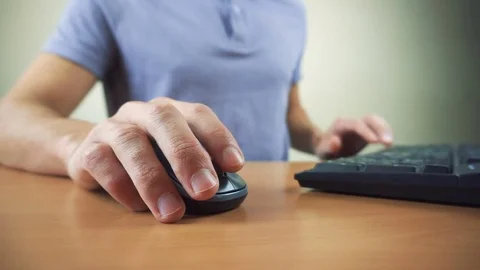 Close up of hands typing on computer keyboard and mouse Stock Footage 83781219