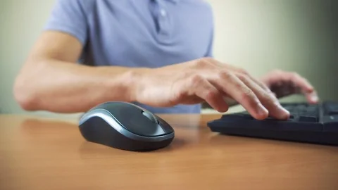 Close up of hands typing on computer keyboard and mouse Video stock 84266823