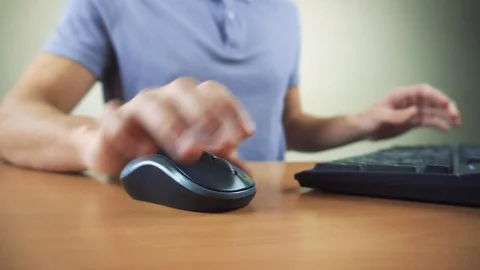 Close up of hands typing on computer keyboard and mouse Stock Footage 84280850