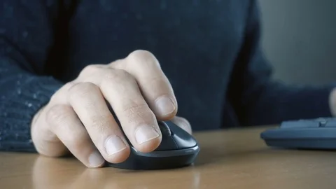 Close up of hands typing on computer keyboard and mouse Stock Footage 84499394