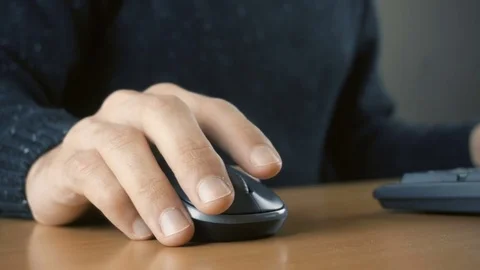 Close up of hands typing on computer keyboard and mouse Stock Footage 84499705