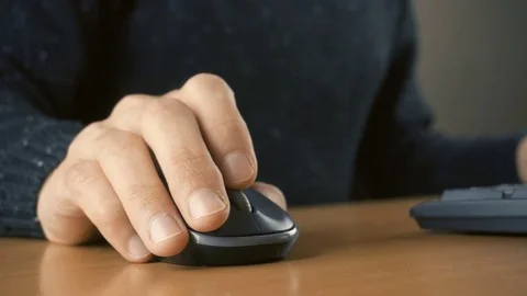Close up of hands typing on computer keyboard and mouse Stock Footage 84499948